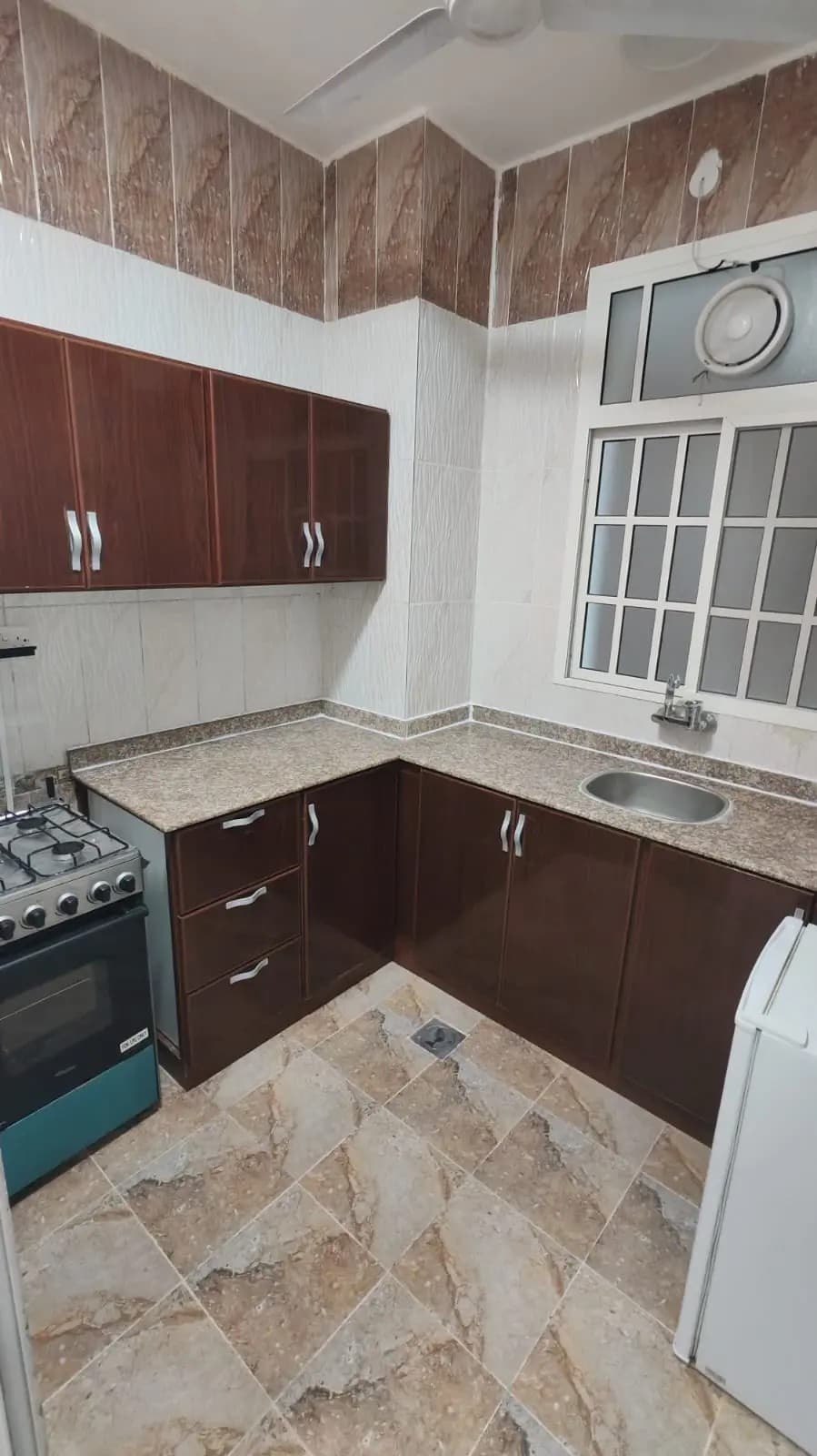 Kitchen and dining area in 1BHK Apartment
